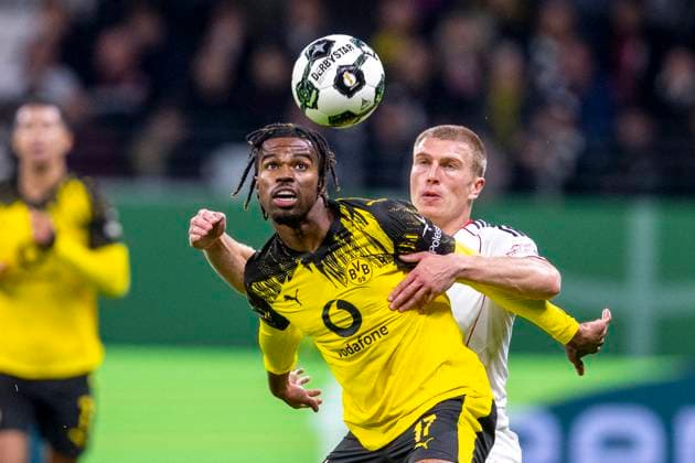 28 10 2025 Football DFB Cup, 2nd round Eintracht Frankfurt Borussia Dortmund at Deutsche Bank Park Carney Chukwuemeka Borussia Dortmund l ud Rasmus Kristensen Eintracht Frankfurt fight for the ball IMPORTANT NOTE In accordance with the regulations of the DFL and the DFB, it is prohibited to use or have used photographs taken in the stadium and or of the match in the form of sequential images and or video-like photo series Copyright: xDavidxInderliedx