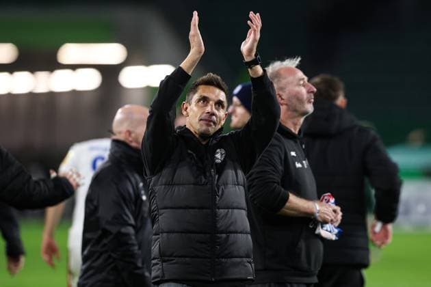Coach Marcel Rapp Holstein Kiel celebrates the victory in front of the fan block 2 round DFB Cup season 2025 2026 VfL Wolfsburg vs Holstein Kiel at the Volkswagen Arena in Wolfsburg Action,Football,Germany,Man,Men,28 10 2025