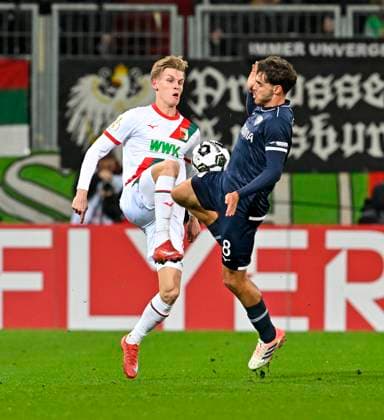 28 10 2025, Football DFB Pokal 2025 2026, 2 Round, FC Augsburg VfL Bochum, in the WWK Arena Augsburg Anton Kade FC Augsburg vs Kjell Wätjen VfL Bochum DFL and DFB regulations prohibit any use of photographs as image sequences and or quasi video