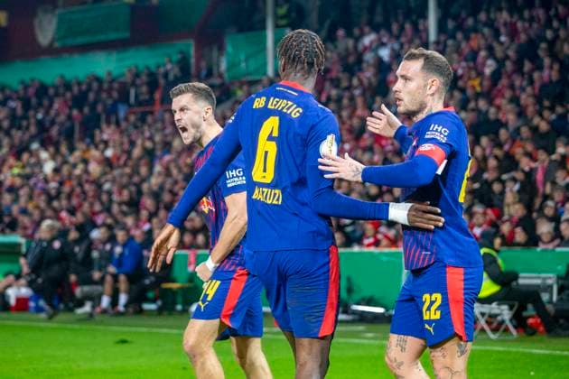 GER, Cottbus, Soccer, DFB Cup, 2nd main round, FC Energie Cottbus vs RB Leipzig in the picture from l Christoph Baumgartner RB Leipzig 14 , Ezechiel Banzuzi RB Leipzig 06 , David Raum RB Leipzig 22 , Torjubel 28 10 2025, LEAG Energie Stadion Cottbus DFB REGULATIONS PROHIBIT ANY USE OF PHOTOGRAPHS AS IMAGE SEQUENCES AND OR QUASI VIDEO, Copyright: HMBxMedia PaulxFritz
