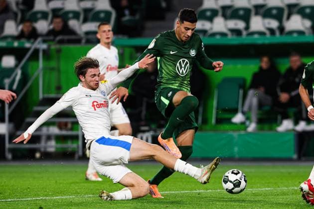 Adam Daghim VfL Wolfsburg,11 vs Magnus Knudsen Holstein Kiel,24 2 Round DFB Cup Season 2025 2026 VfL Wolfsburg vs Holstein Kiel at the Volkswagen Arena in Wolfsburg Action,Football,Germany,Man,Men,28 10 2025