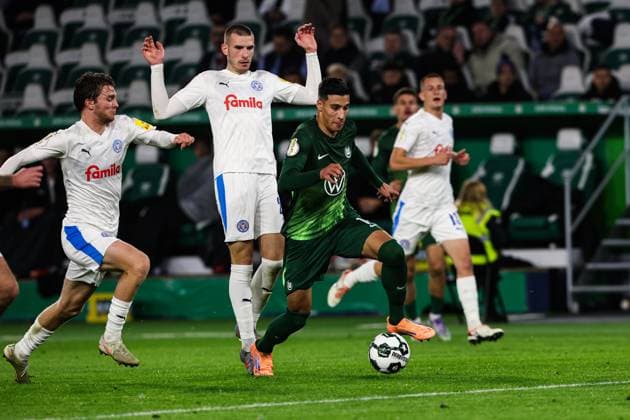 Adam Daghim VfL Wolfsburg,11 vs David Zec Holstein Kiel,26 2 Round DFB Cup Season 2025 2026 VfL Wolfsburg vs Holstein Kiel at the Volkswagen Arena in Wolfsburg Action,Football,Germany,Man,Men,28 10 2025