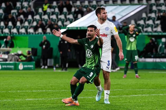 Mohamed Amoura VfL Wolfsburg,9 and Marco Komenda Holstein Kiel,3 2 Round DFB Cup Season 2025 2026 VfL Wolfsburg vs Holstein Kiel at the Volkswagen Arena in Wolfsburg Action,Football,Germany,Man,Men,28 10 2025