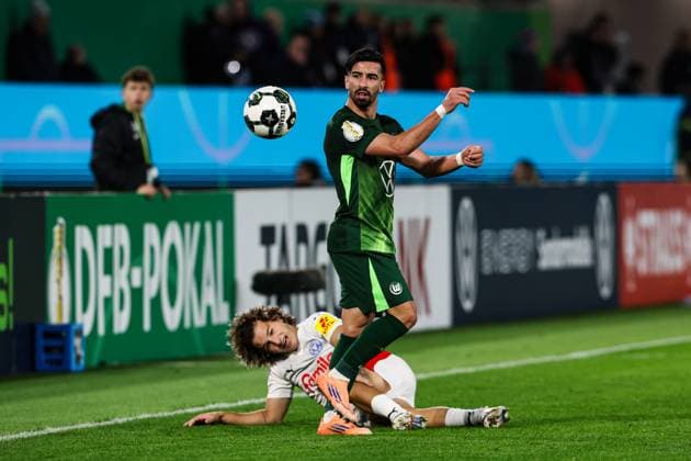 Mohamed Amoura VfL Wolfsburg,9 vs John Tolkin Holstein Kiel,47 2 Round DFB Cup Season 2025 2026 VfL Wolfsburg vs Holstein Kiel at the Volkswagen Arena in Wolfsburg Action,Football,Germany,Man,Men,28 10 2025