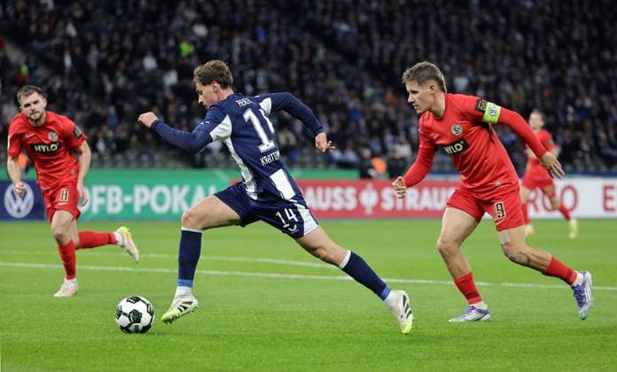 Maurice Krattenmacher on the ball, Lukas Pinckert duel Match scene Action Sport Soccer Football DFB Cup 2nd round Mens season 2025 2026 28 10 2025 Hertha BSC Berlin vs SV Elversberg DFL regulations prohibit any use of photographs as image sequences and or quasi video