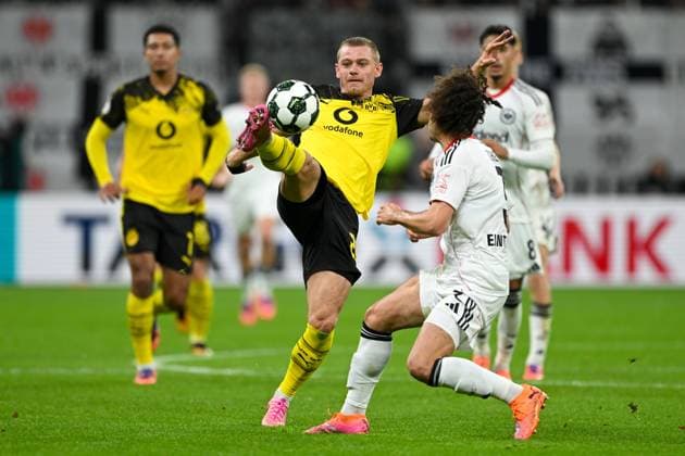Julian Ryerson Dortmund, 26 in duel with Arthur Theate Eintracht Frankfurt, 03 GER, Eintracht Frankfurt vs Borussia Dortmund Football DFB Pokal, 2 Round, Season 2025 2026, 28 10 2025 DFB regulations prohibit any use of photographs as image sequences and or quasi video GER, Eintracht Frankfurt vs Borussia Dortmund Football DFB Pokal, 2 Round, Season 2025 2026, 28 10 2025 Frankfurt am Main Copyright: xEibner-Pressefoto FlorianxWiegandx EP_FWD