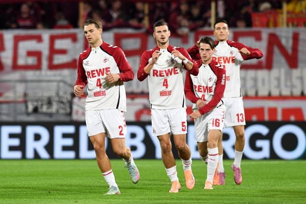 Joel Schmied (1. FC Koeln), Tom Krauss (1. FC Koeln), Jakub Kaminski (1. FC Koeln) und Said El Mala (1. FC Koeln) im Aufwärmtrikot mit der Nummer 4 für Timo Huebers (1. FC Koeln) waehrend des Spiels der 2. Runde im DFB-Pokal zwischen 1. FC Köln und FC Bayern München im Rhein-Energie-Stadion am 29. October 2025 in Köln, Deutschland. (Foto von Ralf Treese DeFodi Images) +++ Joel Schmied (1. FC Koeln), Tom Krauss (1. FC Koeln), Jakub Kaminski (1. FC Koeln) und Said El Mala (1. FC Koeln) look on during the DFB-Cup - Second Round match between 1. FC Koeln and FC Bayern München at Rhein-Energie-Stadion on October 29, 2025 in Koeln, Germany. (Photo by Ralf Treese DeFodi Images) DFB DFL REGULATIONS PROHIBIT ANY USE OF PHOTOGRAPHS AS IMAGE SEQUENCES AND OR QUASI-VIDEO. (Photo by Ralf Treese DeFodi Images) Joel Schmied 1 FC Koeln , Tom Krauss 1 FC Koeln , Jakub Kaminski 1 FC Koeln and Said El Mala 1 FC Koeln in warm up jersey number 4 for Timo Huebers 1 FC Koeln during the DFB Cup Second Round match between 1 FC Koeln and FC Bayern München at Rhein Energie Stadion on October 29, 2025 in Cologne, Germany Photo by Ralf Treese DeFodi Images Joel Schmied 1 FC Koeln , Tom Krauss 1 FC Koeln , Jakub Kaminski 1 FC Koeln and Said El Mala 1 FC Koeln look on during the DFB Cup Second Round match between 1 FC Koeln and FC Bayern München at Rhein Energie Stadion on October 29, 2025 in Koeln, Germany Photo by Ralf Treese DeFodi Images DFB DFL REGULATIONS PROHIBIT ANY USE OF PHOTOGRAPHS AS IMAGE SEQUENCES AND OR QUASI VIDEO Photo by Ralf Treese DeFodi Images