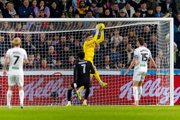 Swansea City v Manchester City EFL Cup 29 10 2025. Swansea City FC s goalkeeper Andy Fisher (1) saves from Manchester City FC forward Omar Mrmoush (7) during the EFL Cup match between Swansea City and Manchester City at the Swansea.com Stadium, Swansea, Wales on 29 October 2025. Swansea Swansea.com Stadium West Glamorgan Wales Editorial use only DataCo restrictions apply See www.football-dataco.com , Copyright: xDanxMintox PSI-23130-0004