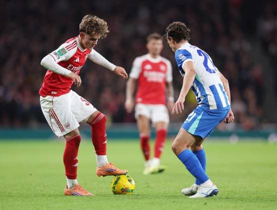London, England, 29th October 2025. Max Dowman of Arsenal (l) tussles with Diego Gomez of Brighton (r) during the Arsenal vs Brighton and Hove Albion Carabao Cup match at the Emirates Stadium, London. Picture credit should read: David Klein Sportimage EDITORIAL USE ONLY. No use with unauthorised audio, video, data, fixture lists, club league logos or live services. Online in-match use limited to 120 images, no video emulation. No use in betting, games or single club league player publications. SPI_013_DK_Arsenal_Brighton SPI-4249-0012