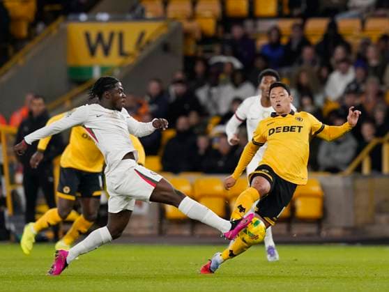 Wolverhampton, England, 29th October 2025. Romeo Lavia of Chelsea (l)) tackles Hee Chan Hwang of Wolverhampton Wanderers (r) during the Wolverhampton Wanderers vs Chelsea Carabao Cup match at Molineux, Wolverhampton. Picture credit should read: Andrew Yates Sportimage EDITORIAL USE ONLY. No use with unauthorised audio, video, data, fixture lists, club league logos or live services. Online in-match use limited to 120 images, no video emulation. No use in betting, games or single club league player publications. SPI_018_AY_Wolves_Chelsea SPI-4247-0018
