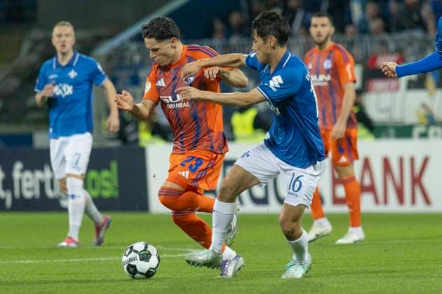 DFB Cup SV Darmstadt 98 FC Schalke 04, 29 10 2025 Soufiane El Faouzi FC Schalke 04 23 Hiroki Akiyama SV Darmstadt 98 16 in a duel for the ball, SV Darmstadt 98 FC Schalke 04, Darmstadt, Merck Stadion am Böllenfalltor, 29 10 2025 Copyright: xBEAUTIFULxSPORTS Gawlikx