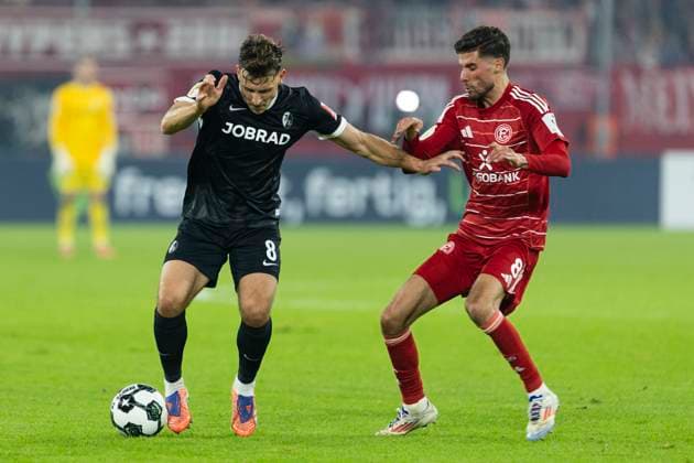 DFB Pokal, Fortuna Duesseldorf vs SC Freiburg, 29 10 2025 DUESSELDORF, GERMANY OCTOBER 29 Maximilian Eggestein SC Freiburg, 8 , Anouar El Azzouzi Fortuna Duesseldorf, 8 during the DFB Pokal match between Fortuna Duesseldorf and SC Freiburg in the second round of DFB Pokal at Merkur Spiel Arena on October 29, 2025 in Duesseldorf, Germany DFL regulations prohibit any use of photographs as image sequences and or quasi video Copyright: xBEAUTIFULxSPORTS Meuselx