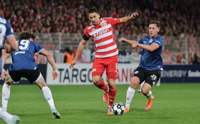 Maximilian Großer, Rani Khedira on the ball, Marius Wörl duel Match scene Action Sport Soccer Football DFB Pokal 2 Round Men Season 2025 2026 29 10 2025 1 FC Union Berlin FCU vs DSC Arminia Bielefeld DFL regulations prohibit any use of photographs as image sequences and or quasi video
