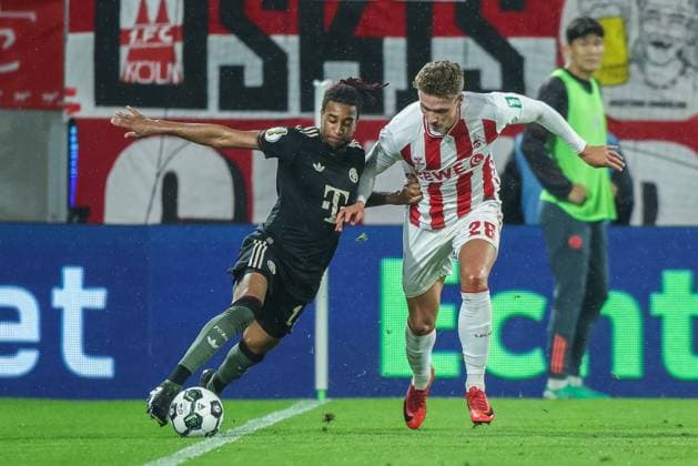 Soccer DFB Pokal 2 Round 1 FC Köln FC Bayern München on 29 10 2025 at RheinEnergieStadion in Cologne Michael Olise Munich , left Sebastian Sebulonsen Cologne , right DFB regulations prohibit any use of photographs as image sequences and or quasi video xJRx