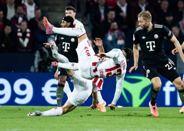 Koeln, RheinEnergieStadion, 29 10 2025 Said El Mala of Koeln falls against Konrad Laimer of Muenchen during the second round DFB Cup match between 1 FC Koeln vs FC Bayern Muenchen