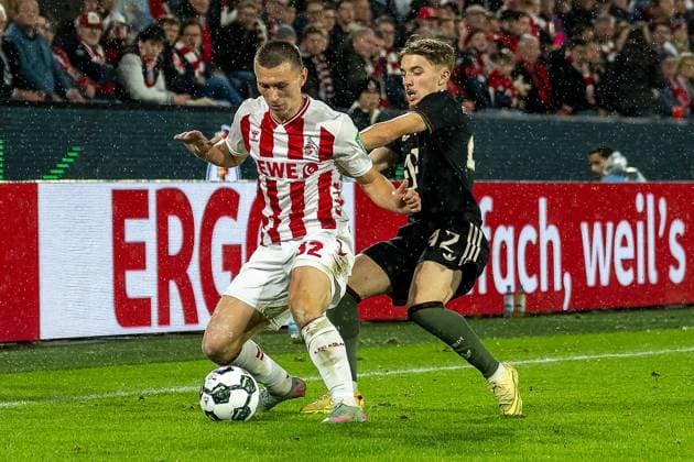 29 10 2025, Football DFB Cup, season 2025 2026, 2nd round, 1 FC Koeln vs FC Bayern Muenchen at RheinEnergie Stadium in Koeln duel between Kristoffer Lund Hansen 1 FC Koeln, 32 and Lennart Karl FC Bayern Muenchen, 42 Important note In accordance with the regulations of the DFL German Football League and the DFB German Football Association, it is prohibited to utilize or have utilized photographs taken in the stadium and or of the match in the form of sequential images and or video-like photo series Foto Kirchner Media Thomas Haesler Copyright: xKirchner-Media ThomasxHaeslerx