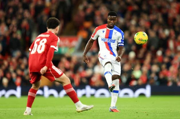 Liverpool, England, 29th October 2025. Marc Guehi of Crystal Palace passes the ball whilst under pressure from Kieran Morrison of Liverpool during the Liverpool vs Crystal Palace Carabao Cup match at Anfield, Liverpool. Picture credit should read: Jessica Hornby Sportimage EDITORIAL USE ONLY. No use with unauthorised audio, video, data, fixture lists, club league logos or live services. Online in-match use limited to 120 images, no video emulation. No use in betting, games or single club league player publications. SPI_037_JH_Liverpool_Crystal_Palace SPI-4246-0037