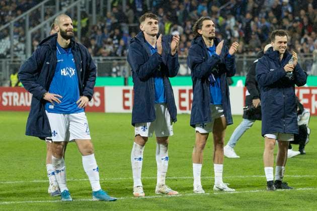 DFB Cup SV Darmstadt 98 FC Schalke 04, 29 10 2025 Aleksandar Vukotic SV Darmstadt 98 20 Bartosz Bialek SV Darmstadt 98 27 Fraser Hornby SV Darmstadt 98 9 Sergio Lopez SV Darmstadt 98 2 celebrate after the match in front of the fans, SV Darmstadt 98 FC Schalke 04, Darmstadt, Merck Stadion am Böllenfalltor, 29 10 2025 Copyright: xBEAUTIFULxSPORTS Gawlikx
