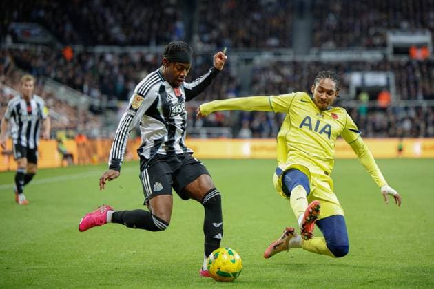 29th October 2025; St James Park, Newcastle, England; EFL Carabao Cup Football, Newcastle United versus Tottenham Hotspur; Djed Spence of Tottenham Hotspur attempts to block a cross by Anthony Elanga of Newcastle United  CraigxCowan