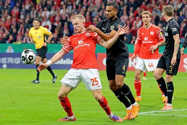 Mainz, Germany 29 October 2025 DFB Pokal 2025 2026 1 FSV Mainz 05 vs VfB Stuttgart In the picture from left in the duel Andreas Hanche Olsen Mainz against Josha Vagnoman Stuttgart DFB regulations prohibit any use of photographs as image sequences and or quasi video Mewa Arena Rheinland Pfalz Copyright: xFotostandx xRacochax