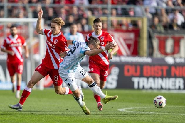 Lukas Michelbrink 8 FC Energie Cottbus fouls Sigurd Haugen 22 TSV 1860 Muenchen , TSV 1860 Muenchen vs Energie Cottbus, 3 Liga, 13 Spieltag, 01 11 2025 DFB regulations prohibit any use of photographs as image sequences and or quasi video Muenchen Bayern Germany Copyright: xkolbert-press UlrichxGamelx