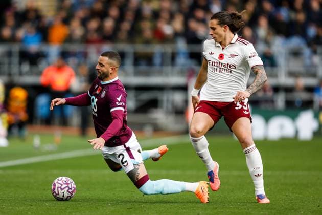 Burnley v Arsenal Premier League Kyle Walker of Burnley and Riccardo Calafiori of Arsenal during the Premier League match at Turf Moor, Burnley UK Newspapers OUT Copyright: xMaxxTomlinsonx FIL-22434-0046