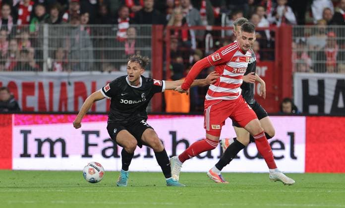 Max Rosenfelder, Andrej Ilic duel match scene Action Sport Football Soccer Bundesliga Men DFL 9 Matchday Season 2025 2026 01 11 2025 1 FC Union Berlin FCU vs SC Freiburg SCF DFL regulations prohibit any use of photographs as image sequences and or quasi video