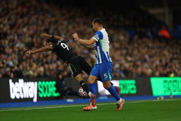 Football - 2025 2026 Premier League - Brighton & Hove Albion vs Leeds United - The Amex - Saturday 1st November 2025 Lewis Dunk of Brighton gives a gentle shove to Dominic Calvert-Lewin of Leeds United during the Premier League match at the Amex Stadium COLORSPORT Shaun Boggust 