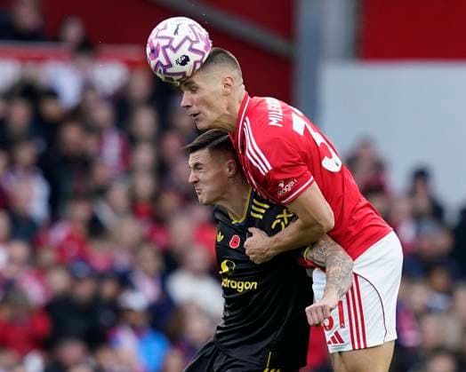 Nottingham, England, 1st November 2025. Nikola Milenkovic of Nottingham Forest (R) heads clear from Benjamin Sesko of Manchester United, ManU during the Nottingham Forest vs Manchester United Premier League match at the City Ground, Nottingham. Picture credit should read: Andrew Yates Sportimage EDITORIAL USE ONLY. No use with unauthorised audio, video, data, fixture lists, club league logos or live services. Online in-match use limited to 120 images, no video emulation. No use in betting, games or single club league player publications. SPI_016_AY_FOREST_MAN_UTD SPI-4253-0016