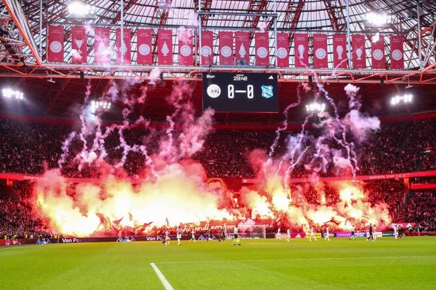 2025-11-01 Ajax v sc Heerenveen - Dutch Eredivisie AMSTERDAM, NETHERLANDS - NOVEMBER 1: Fans and Supporters of AFC Ajax hold up flags and banners and set off flares to remember the death of an Ajax fan Patrick Overeem during the Dutch Eredivisie match between Ajax and sc Heerenveen at Johan Cruijff ArenA on November 1, 2025 in Amsterdam, Netherlands. Amsterdam Johan Cruijff ArenA Netherlands Content not available for redistribution in The Netherlands directly or indirectly through any third parties. Copyright: xBenxGalx