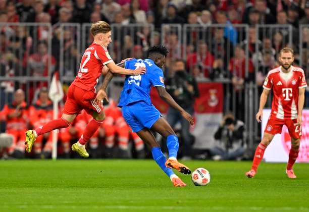 01 11 2025, Soccer Bundesliga 2025 2026, Matchday 9, FC Bayern Munich Bayer Leverkusen, in the Allianz Arena Munich, f l Lennart Karl FC Bayern Munich vs Edmond Tapsoba Leverkusen DFL and DFB regulations prohibit any use of photographs as image sequences and or quasi video