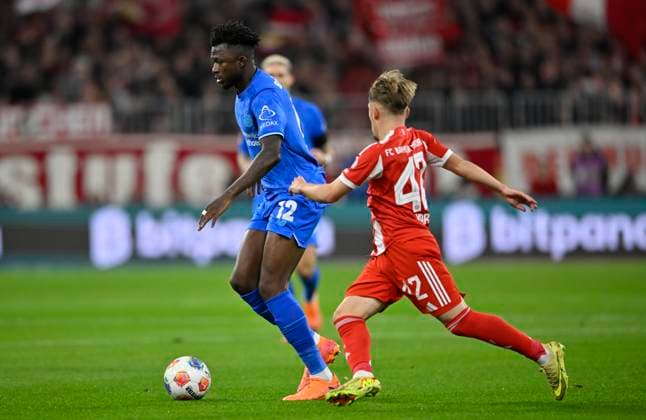 duel, action Edmond Tapsoba Bayer 04 Leverkusen 12 vs Lennart Karl Bayern Muenchen FCB 42 FC Bayern Muenchen FCB vs Bayer 04 Leverkusen B04 01 11 2025 DFL REGULATIONS PROHIBIT ANY USE OF PHOTOGRAPHS AS IMAGE SEQUENCES AND OR QUASI VIDEO FC Bayern Muenchen FCB vs Bayer 04 Leverkusen B04