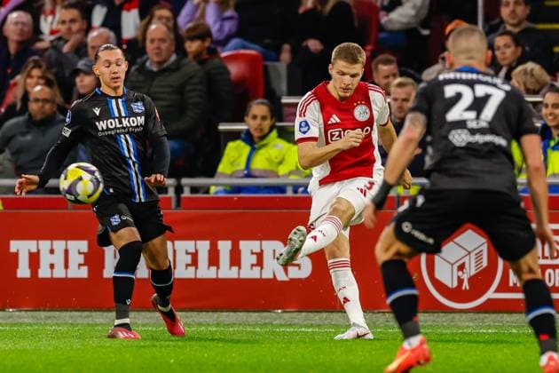 2025-11-01 Ajax v sc Heerenveen - Dutch Eredivisie AMSTERDAM, NETHERLANDS - NOVEMBER 1: Anton Gaaei of AFC Ajax passes the ball during the Dutch Eredivisie match between Ajax and sc Heerenveen at Johan Cruijff ArenA on November 1, 2025 in Amsterdam, Netherlands. Amsterdam Johan Cruijff ArenA Netherlands Content not available for redistribution in The Netherlands directly or indirectly through any third parties. Copyright: xBenxGalx