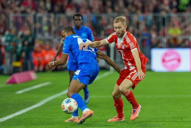 in duel, action, with Jeanuel Belocian 44 Bayer 04 Leverkusen , Konrad Laimer 27 FC Bayern Muenchen , FC Bayern Muenchen vs Bayer 04 Leverkusen, Soccer, 1 Bundesliga, 9 Matchday, 01 11 2025 DFB regulations prohibit any use of photographs as image sequences and or quasi video Muenchen Bayern Germany Copyright: xkolbert-press ChristianxKolbertx