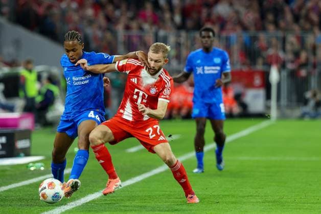 in duel, action, with Jeanuel Belocian 44 Bayer 04 Leverkusen , Konrad Laimer 27 FC Bayern Muenchen , FC Bayern Muenchen vs Bayer 04 Leverkusen, Soccer, 1 Bundesliga, 9 Matchday, 01 11 2025 DFB regulations prohibit any use of photographs as image sequences and or quasi video Muenchen Bayern Germany Copyright: xkolbert-press ChristianxKolbertx