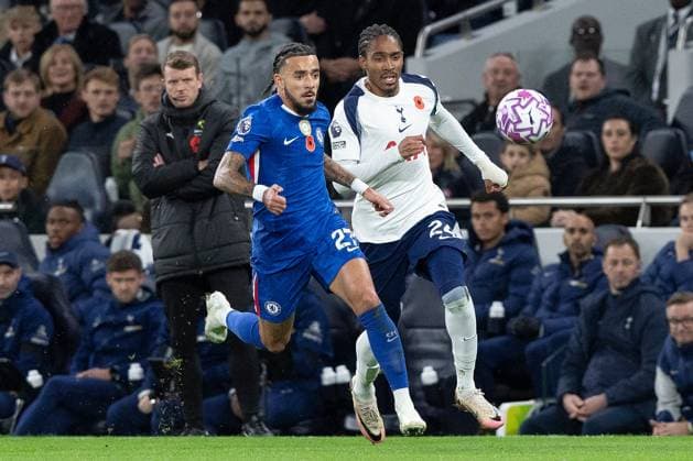 1st November 2025; Tottenham Hotspur Stadium, London, England; Premier League Football, Tottenham Hotspur versus Chelsea; Malo Gusto of Chelsea battles for possession with Djed Spence of Tottenham Hotspur watched by fourth official Sam Barrott  IanxStephen