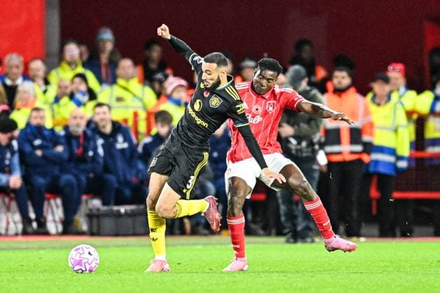 1st November 2025; The City Ground, Nottingham, England; Premier League Football, Nottingham Forest versus Manchester United, ManU Taiwo Awoniyi of Nottingham Forest tussles with Noussair Mazraoui of Manchester United  GodfreyxPitt