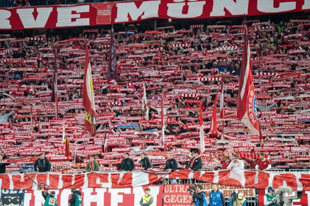 Fans FC Bayern Muenchen with scarves, FC Bayern Muenchen vs Bayer 04 Leverkusen, Football, 1 Bundesliga, 9 Matchday, 01 11 2025 DFB regulations prohibit any use of photographs as image sequences and or quasi video Muenchen Bayern Germany Copyright: xkolbert-press MarcxMarasescux