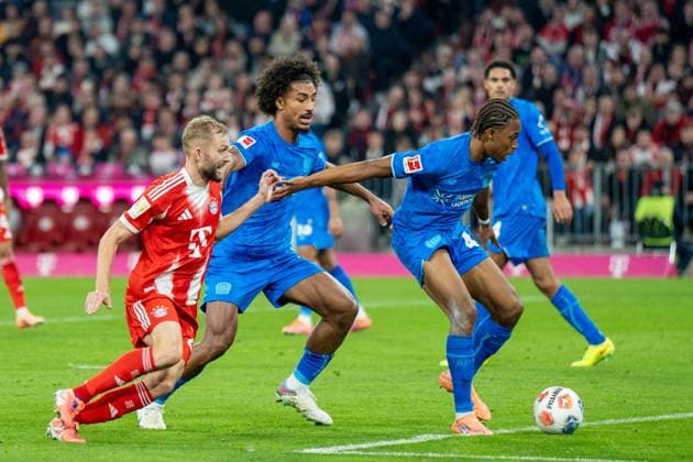 in duel, action, with Konrad Laimer 27 FC Bayern Muenchen , Jeanuel Belocian 44 Bayer 04 Leverkusen , FC Bayern Muenchen vs Bayer 04 Leverkusen, Football, 1 Bundesliga, 9 Matchday, 01 11 2025 DFB regulations prohibit any use of photographs as image sequences and or quasi video Muenchen Bayern Germany Copyright: xkolbert-press MarcxMarasescux