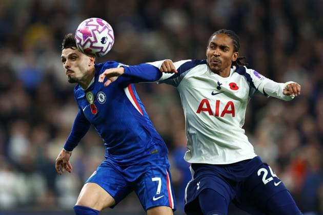 London, England, 1st November 2025. Pedro Neto of Chelsea and Djed Spence of Tottenham Hotspur challenge for the ball during the Tottenham Hotspur vs Chelsea Premier League match at the Tottenham Hotspur Stadium, London. Picture credit should read: Paul Terry Sportimage EDITORIAL USE ONLY. No use with unauthorised audio, video, data, fixture lists, club league logos or live services. Online in-match use limited to 120 images, no video emulation. No use in betting, games or single club league player publications. SPI_064_PT_Tottenham_Chelsea SPI-4252-0064