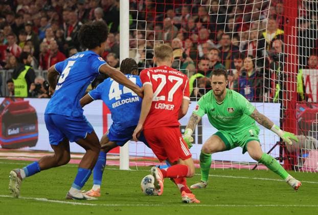 (251102) -- MUNICH, Nov. 2, 2025 -- Loic Bade (1st L), Jeanuel Belocian (2nd L) and goalkeeper Mark Flekken (1st R) of Bayer 04 Leverkusen defend Konrad Laimer of Bayern Munich during the German first division Bundesliga football match between Bayern Munich and Bayer 04 Leverkusen in Munich, Germany, Nov. 1, 2025. (Photo by Xinhua) (SP)GERMANY-MUNICH-FOOTBALL-BUNDESLIGA-BAYERN MUNICH VS LEVERKUSEN PhilippexRuiz 