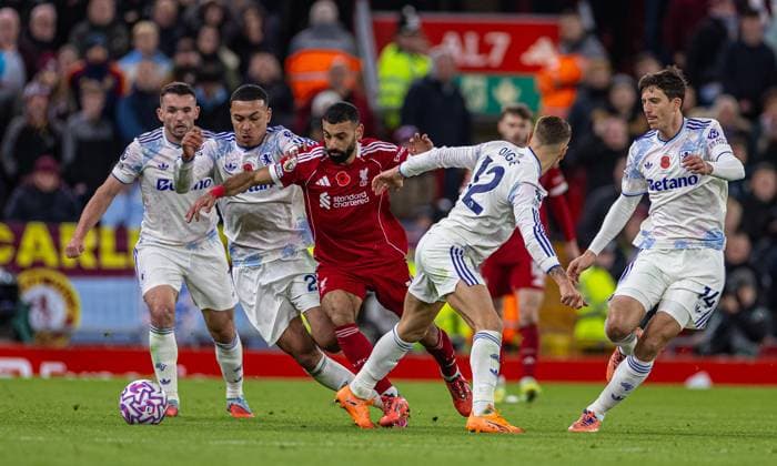 (251102) -- LIVERPOOL, Nov. 2, 2025 -- Liverpool s Mohamed Salah takes on four Aston Villa players during the English Premier League match between Liverpool FC and Aston Villa FC in Liverpool, Britain, on Nov. 1, 2025. FOR EDITORIAL USE ONLY. NOT FOR SALE FOR MARKETING OR ADVERTISING CAMPAIGNS. NO USE WITH UNAUTHORIZED AUDIO, VIDEO, DATA, FIXTURE LISTS, CLUB LEAGUE LOGOS OR LIVE SERVICES. ONLINE IN-MATCH USE LIMITED TO 45 IMAGES, NO VIDEO EMULATION. NO USE IN BETTING, GAMES OR SINGLE CLUB LEAGUE PLAYER PUBLICATIONS. (SP)BRITAIN-LIVERPOOL-FOOTBALL-PREMIER LEAGUE-LIVERPOOL VS ASTON VILLA (Xinhua)