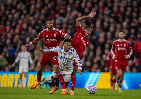 (251102) -- LIVERPOOL, Nov. 2, 2025 -- Aston Villa s Ollie Watkins is challenged by Liverpool s Cody Gakpo (L) and Ryan Gravenberch (R) during the English Premier League match between Liverpool FC and Aston Villa FC in Liverpool, Britain, on Nov. 1, 2025. FOR EDITORIAL USE ONLY. NOT FOR SALE FOR MARKETING OR ADVERTISING CAMPAIGNS. NO USE WITH UNAUTHORIZED AUDIO, VIDEO, DATA, FIXTURE LISTS, CLUB LEAGUE LOGOS OR LIVE SERVICES. ONLINE IN-MATCH USE LIMITED TO 45 IMAGES, NO VIDEO EMULATION. NO USE IN BETTING, GAMES OR SINGLE CLUB LEAGUE PLAYER PUBLICATIONS. (SP)BRITAIN-LIVERPOOL-FOOTBALL-PREMIER LEAGUE-LIVERPOOL VS ASTON VILLA (Xinhua)