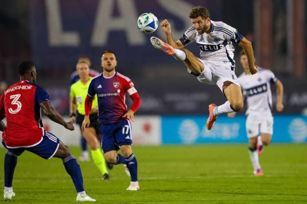 November 1, 2025, Frisco, Texas, USA: VancouverÃ¢â‚¬â ¢s THOMAS MULLER (6) leaps to kick the ball as OSAZE URHOGHIDE (3) prepares to intercept the ball in the second half of game 2 in their playoff series against FC Dallas on Saturday at Toyota Stadium in Frisco on Saturday. In the background is FC Dallas (C) RAMIRO. Frisco USA - ZUMAm257 20251101_zsp_m257_025 Copyright: xBrianxMcLeanx