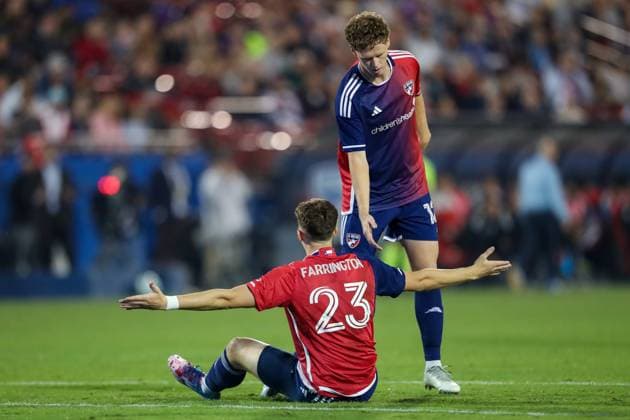 November 1, 2025, Frisco, Texas, USA: FC DallasÃ¢â‚¬â ¢s CHRISTIAN CAPPIS (12) reaches out to teammate LOGAN FARRINGTON (23) during the first half of game two of their playoff series against the Vancouver Whitecaps at Toyota Stadium in Frisco on Saturday. Frisco USA - ZUMAm257 20251101_zsp_m257_009 Copyright: xBrianxMcLeanx