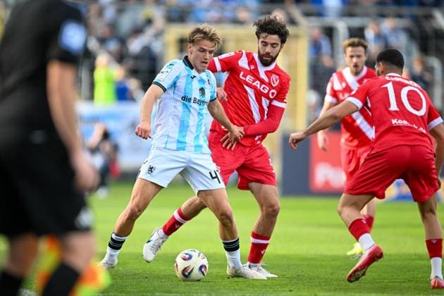 3 Liga 25 26 TSV 1860 München FC Energie Cottbus on 01 11 2025 at Stadion Gruenwalder Straße in Munich Dominik Pelivan Cottbus in a duel against Jesper Verlaat Muenchen MT