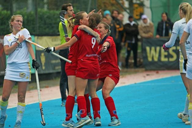 Womens Field Hockey Bundesliga Berlin HC players celebrate a goal against HTHC