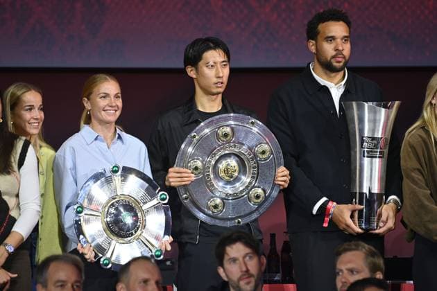 Group picture of all German champions of the club in the 2024 2025 season from left Giulia GWINN FCB , Magdalena ERIKSSON FCB with championship trophy, Hiroki ITO Bayern Muenchen with championship trophy, Elias HARRIS FCB with trophy, cup, trophy Annual General Meeting 2025 of FC Bayern Muenchen e V on 02 11 2025, Rudi Sedlmayer Halle