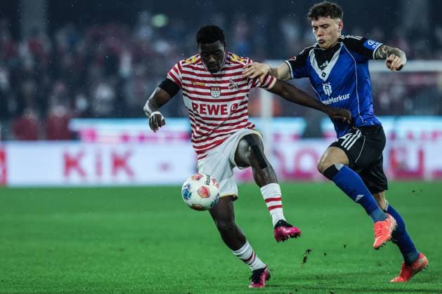 Sport, Football, Bundesliga Season 2025 2026 9 Matchday 1 FC Köln Hamburger SV 02 11 2025, RheinEnergieSTADION Ragnar Ache 1 FC Köln, 9 Nicolai Remberg Hamburger SV, 21 Zweikampf Köln RheinEnergieSTADION Nordrhein Westfalen Germany