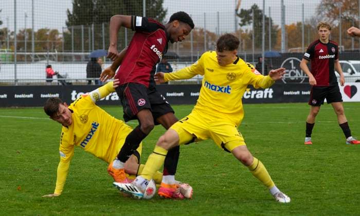 02 11 2025 Soccer Season 2025 2026 Regionalliga Bayern 16 Matchday 1 FC Nürnberg FCN II Club SpVgg Bayreuth MiOt xmixotx 02 11 2025 Soccer Season 2025 2026 Regionalliga Bayern 16 Matchday 1 FC Nürnberg FCN II Club SpVgg Bayreuth MiOt xmixotx Nicolas Andermatt SpVgg Bayreuth, yellow jersey, lying and Leon Bucher SpVgg Bayreuth, yellow jersey, standing against Winners Osawe